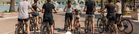 A group of cyclists riding together in Valencia